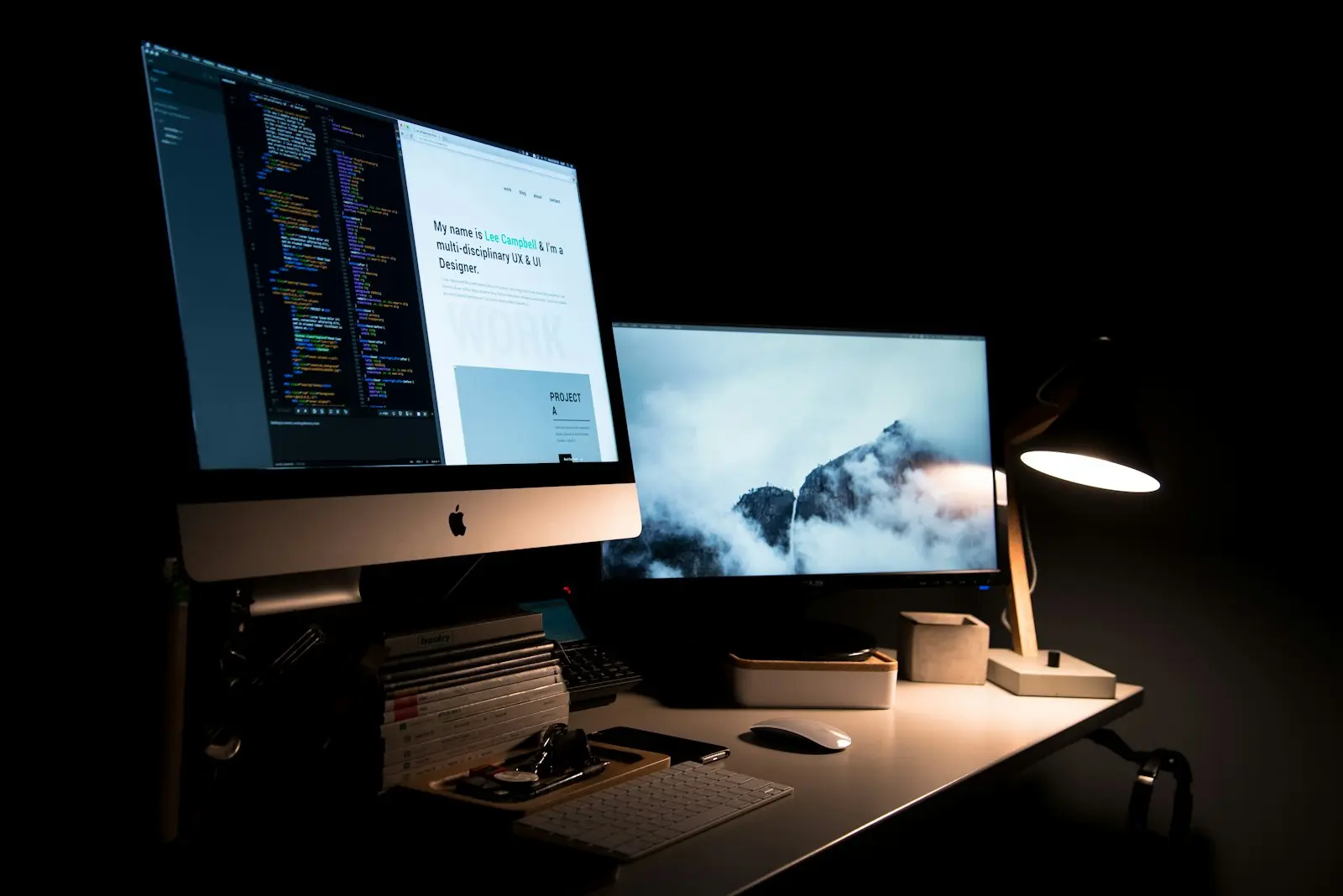 A dark workspace lit by a single lamp